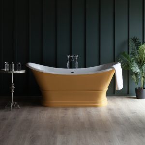 Luxurious freestanding bathtub with antique gold finish and classic chrome fixtures, set against a dark green wooden wall with lush indoor plants, exemplifies elegant bathroom design by Albion Bath Co Ltd.