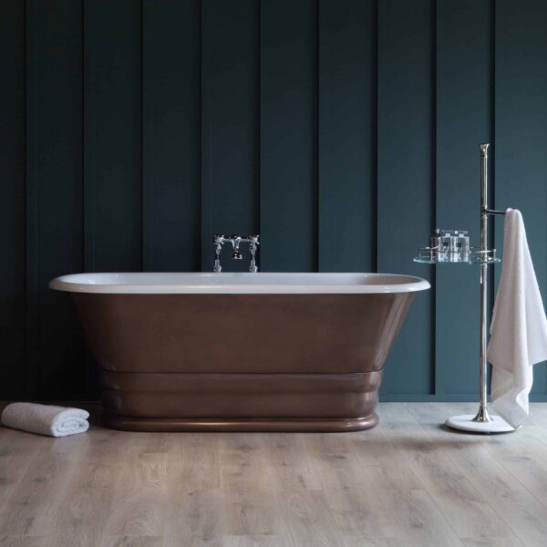 Luxury freestanding bathtub with a metallic finish set against a dark paneled wall, creating an elegant and modern bathroom aesthetic. Perfect for relaxing baths in stylish home interiors.