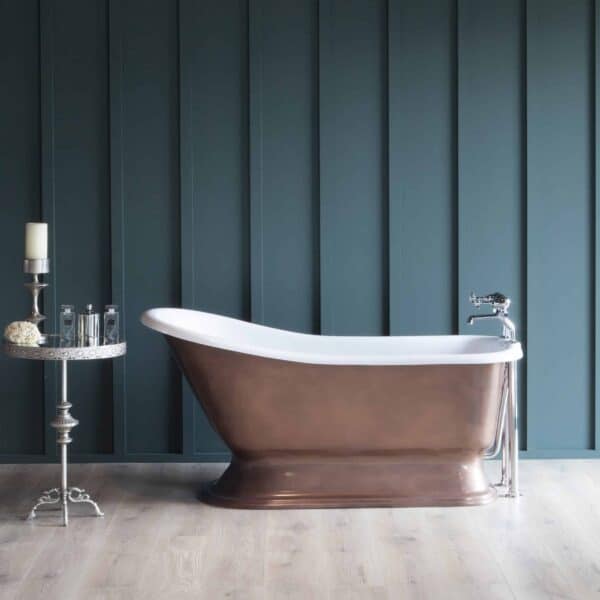 Luxurious freestanding copper bathtub in a modern bathroom with blue wooden panel walls and light wood flooring. Elegant Victorian-style design, perfect for spa and upscale bath installations.