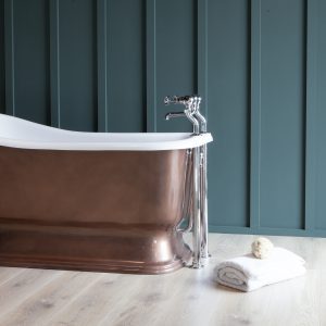 Neptune Advance bath - slightly angled end view showing overflow pipe. Bath shown with burnished Bronze exterior.