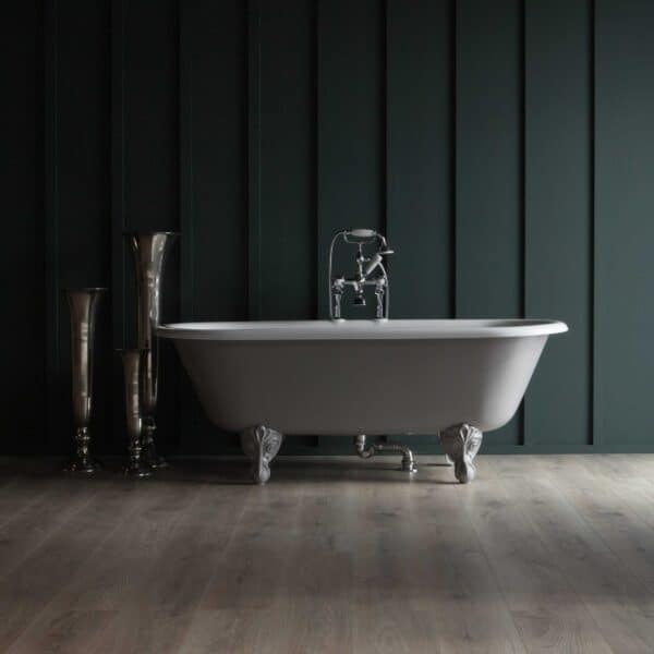 Elegant vintage-style freestanding bathtub with chrome fixtures, set against dark paneled wall, showcasing Albion Bath Co's luxury bathroom fixtures with a modern timeless design.