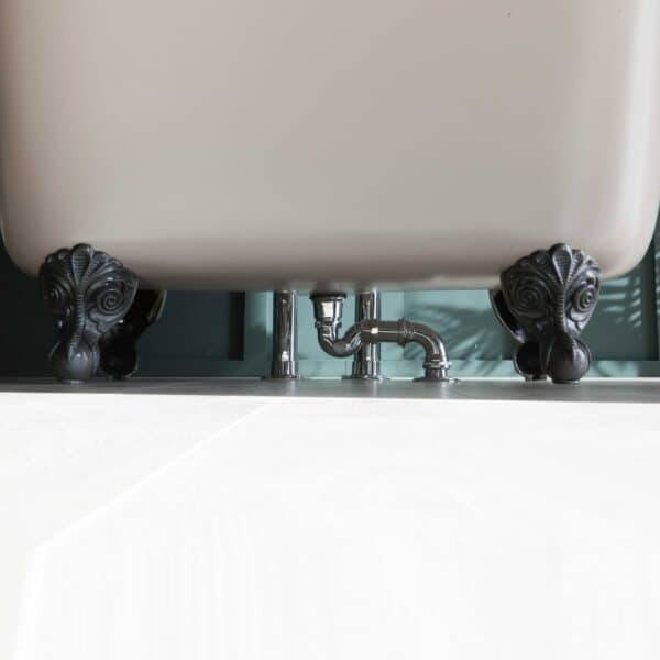Ornate clawfoot bathtub with decorative black feet and modern plumbing, showcasing premium bathroom design and luxury bath fixtures from The Albion Bath Co Ltd.