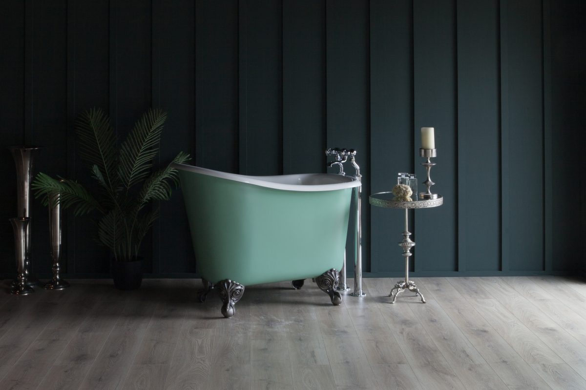 Tubby single ended bath side on slightly angled view. Bath shown with painted exterior and burnished iron feet.