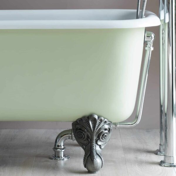Elegant vintage-style cast iron clawfoot bathtub with clawed lion paw leg, chrome fixtures, and a soft pastel green finish, perfect for luxury bathroom renovation or design.