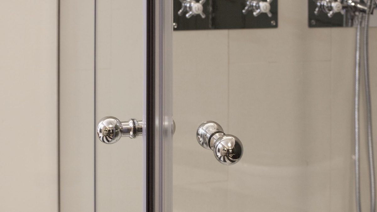 Close up of the Albion Shower Enclosure Door Knobs finished in polished stainless steel.