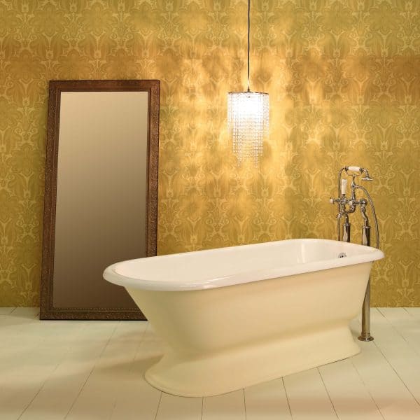 Vintage roll-top freestanding bath with classic chrome fixtures against elegant gold damask wallpaper and a full-length ornate mirror. Perfect for luxurious bathroom designs.