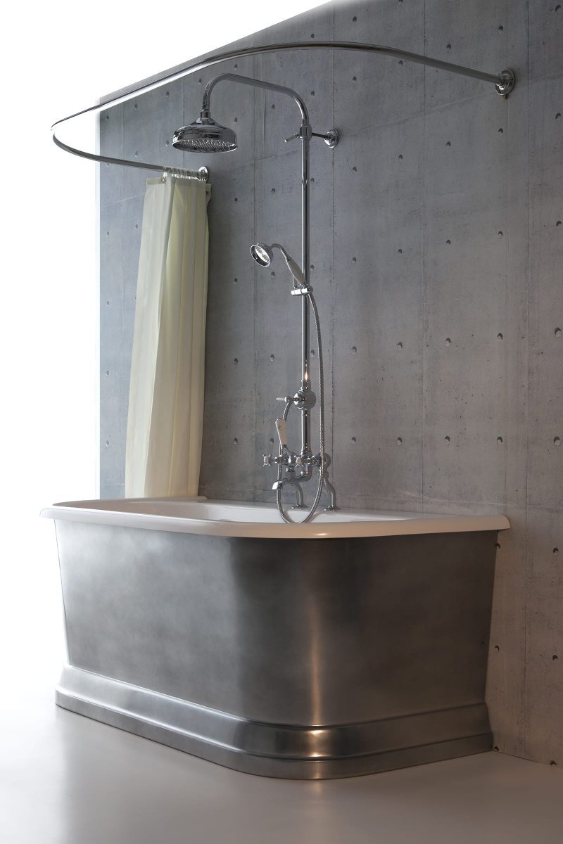 Albion Torre Dee bath with an over-bath shower curtain and burnished iron exterior.